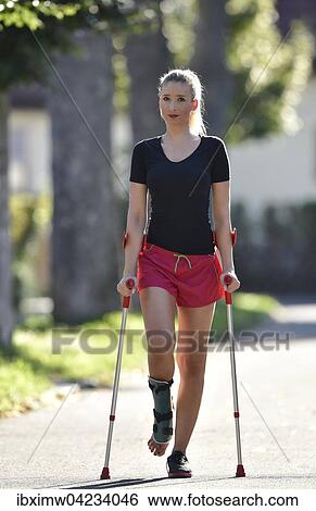Young woman with crutches, walking with a foot injury, with a plaster splint, Germany, Europe View Large Photo Image Stock Photograph - Young woman with crutches, walking with a foot injury, with a plaster splint, Germany, Europe. Fotosearch