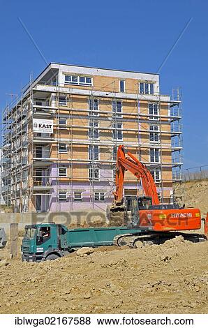 A building pit is being excavated, earth works, construction of an apartment building in Ulm, Baden-Wuerttemberg, Germany, Europe, PublicGround, Europe View Large Photo Image Stock Photo - A building pit is being excavated, earth works, construction of an apartment building in Ulm, Baden-Wuerttemberg, Germany, Europe, PublicGround, Europe. Fotosearch