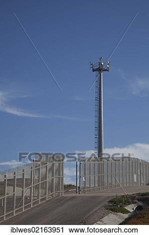 Stock Image - A U. S. Border Patrol surveillance tower at the international border between the United States and Mexico, San Ysidro, California, USA, North America. Fotosearch