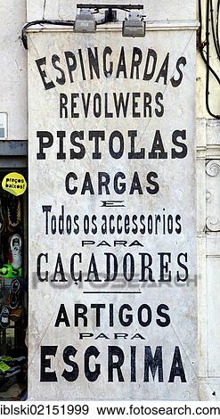 Advertising at a gun shop in Lisbon, Portugal, Europe View Large Photo Image Stock Photo - Advertising at a gun shop in Lisbon, Portugal, Europe. Fotosearch