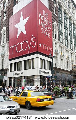 Advertising hoarding at a street corner, Macy's, traditional department store, yellow cab, taxi, Herald Square, intersection of Broadway and 6th Avenue, New York City, USA, North America, America, North America View Large Photo Image Picture - Advertising hoarding at a street corner, Macy's, traditional department store, yellow cab, taxi, Herald Square, intersection of Broadway and 6th Avenue, New York City, USA, North America, America, North America. Fotosearch