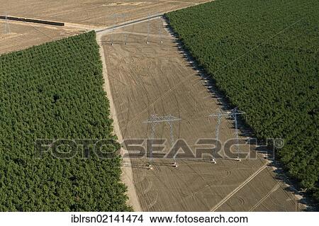 Aerial view of electricity pylons in the agricultural landscape of Central Valley, Fresno, California, USA, North America View Large Photo Image Picture - Aerial view of electricity pylons in the agricultural landscape of Central Valley, Fresno, California, USA, North America. Fotosearch