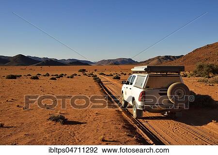 All-terrain vehicle drives on sandtrack, Tiras Mountains, Namibia, Africa View Large Photo Image Stock Image - All-terrain vehicle drives on sandtrack, Tiras Mountains, Namibia, Africa. Fotosearch