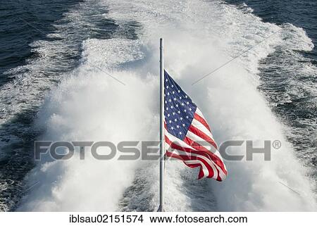 American flag in front of a boats wake, near Bar Harbor, Maine, New England, USA, North America, America, North America View Large Photo Image Picture - American flag in front of a boats wake, near Bar Harbor, Maine, New England, USA, North America, America, North America. Fotosearch