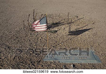 American flag in the Memory Gardens Cemetery and Memorial Park, which is in foreclosure; the irrigation has been cut off and sand is beginning to cover some of the grave markers, Brawley, California, USA, North America View Large Photo Image Stock Photo - American flag in the Memory Gardens Cemetery and Memorial Park, which is in foreclosure; the irrigation has been cut off and sand is beginning to cover some of the grave markers, Brawley, California, USA, North America. Fotosearch