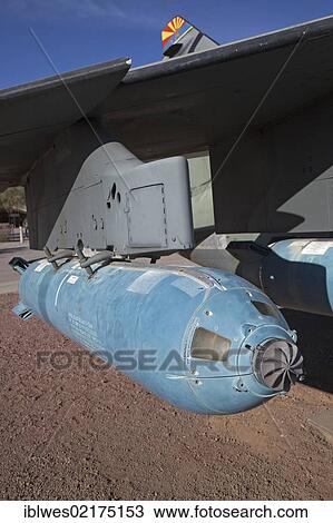 Stock Image - An anti-tank cluster bomb mounted under the wing of a Vought A-7 Corsair II fighter on display at the Pima Air & Space Museum, the museum displays 300 military and civilian aircraft, Tucson, Arizona, USA, North America. Fotosearch