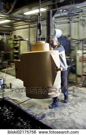 An employee of Luitpoldhuette AG, a foundry that specializes in the casting of engine blocks, motor parts and refrigeration compressors, making a core for mould casting, in Amberg, Bavaria, Germany, Europe View Large Photo Image Stock Photograph - An employee of Luitpoldhuette AG, a foundry that specializes in the casting of engine blocks, motor parts and refrigeration compressors, making a core for mould casting, in Amberg, Bavaria, Germany, Europe. Fotosearch