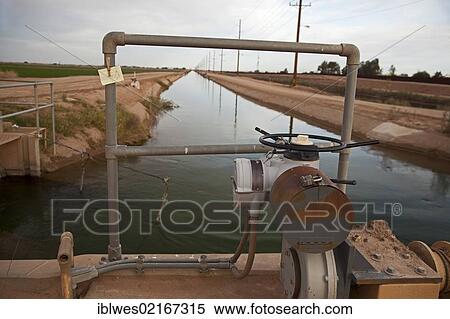 An irrigation ditch branching from the All-American Canal brings water from the Colorado River to irrigate the Imperial Valley, Calexico, California, USA, North America View Large Photo Image Stock Photography - An irrigation ditch branching from the All-American Canal brings water from the Colorado River to irrigate the Imperial Valley, Calexico, California, USA, North America. Fotosearch