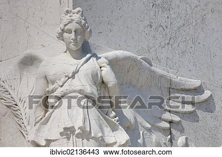 Stock Image - Angel statue in white marble, at the Il Vittoriano monument, Piazza Venezia, Rome, Italy, Europe. Fotosearch