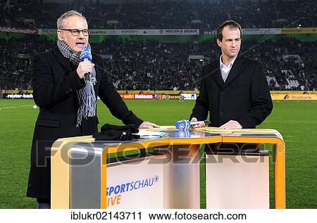 Stock Image - ARD presenter Reinhold Beckmann and ARD expert Mehmet Scholl at the Sportschau desk, VfL Borussia Moenchengladbach - FC Bavaria Munich, 3: 1, Borussia Park, Monchengladbach, North Rhine-Westphalia, Germany, Europe. Fotosearch