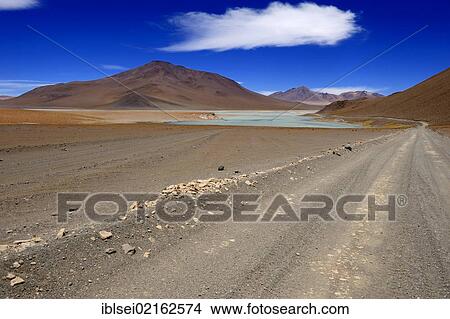 Atacama Desert with Laguna Blanca mountain range and clouds in the sky, Uyuni, Bolivia, South America View Large Photo Image Picture - Atacama Desert with Laguna Blanca mountain range and clouds in the sky, Uyuni, Bolivia, South America. Fotosearch