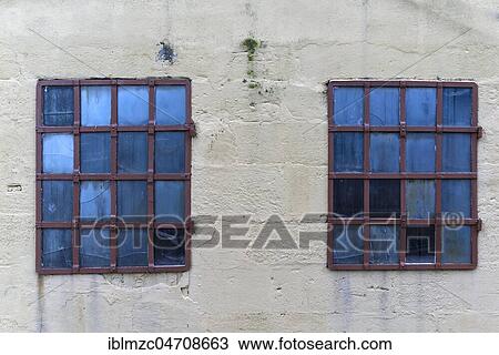 Stock Image - Barred windows of an old factory building, Bavaria, Germany, Europe. Fotosearch