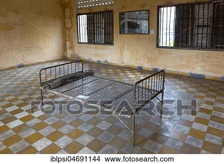 Bed at interrogation room of S-21 Prison, Tuol Sleng Genocide Museum in Phnom Penh, Cambodia, Asia View Large Photo Image Picture - Bed at interrogation room of S-21 Prison, Tuol Sleng Genocide Museum in Phnom Penh, Cambodia, Asia. Fotosearch