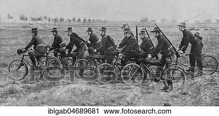 Stock Image - Belgian soldiers riding bikes in the countryside, 1914, Belgium, Europe. Fotosearch