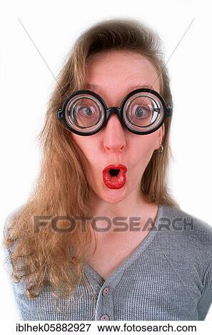 Stock Photo - Blonde woman with glasses, amazed, grimace, Berlin, Germany, Europe. Fotosearch