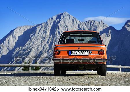 BMW 2002 tii, classic car on the Rossfeld panorama road, in the back the summit of the Hohe Göll, Berchtesgaden, Upper Bavaria, Bavaria, Germany, Europe View Large Photo Image Stock Photography - BMW 2002 tii, classic car on the Rossfeld panorama road, in the back the summit of the Hohe Göll, Berchtesgaden, Upper Bavaria, Bavaria, Germany, Europe. Fotosearch