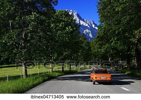 BMW 2002 tii-Oldtimer on Eibseestraße, in the back the Zugspitze, Grainau, Upper Bavaria, Bavaria, Germany, Europe View Large Photo Image Stock Photography - BMW 2002 tii-Oldtimer on Eibseestraße, in the back the Zugspitze, Grainau, Upper Bavaria, Bavaria, Germany, Europe. Fotosearch
