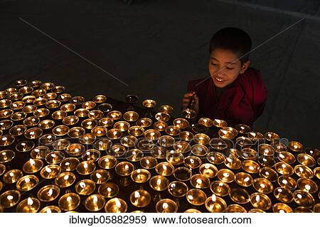 Buddhist children's monk, novice lights butter lamps, Lamayuru Monastery, Ladakh, India, Asia View Large Photo Image Stock Photo - Buddhist children's monk, novice lights butter lamps, Lamayuru Monastery, Ladakh, India, Asia. Fotosearch