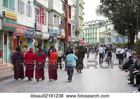 Stock Photo - Buddhist monks strolling in the pedestrian zone, shopping street, Mahatma Gandhi Road, Gangtok, Sikkim, Himalayas, India, South Asia, Asia. Fotosearch