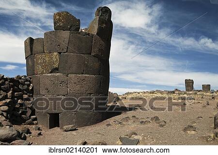 Stock Image - Burial towers called chullpas, of the Aymara people from the Colla culture above Lake Umayo near Puno, conquered by the Incas in the 15th Century and reused, Puno, Peru, South America. Fotosearch