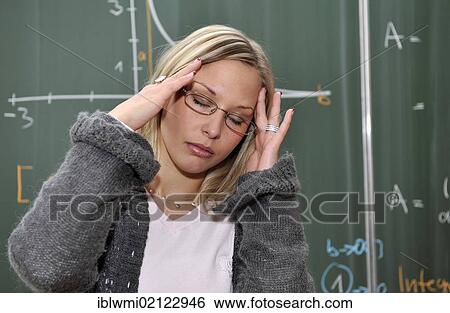 Burnout, trainee teacher, prospective teacher, young teacher, exhausted, desperate, mathematics, blackboard, classroom, Baden-Wuerttemberg, Germany, Europe View Large Photo Image Stock Photograph - Burnout, trainee teacher, prospective teacher, young teacher, exhausted, desperate, mathematics, blackboard, classroom, Baden-Wuerttemberg, Germany, Europe. Fotosearch