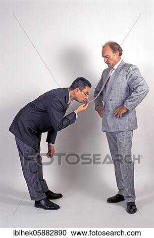 Businessman kisses another man's tie, funny, submissive, Berlin, Germany, Europe View Large Photo Image Stock Image - Businessman kisses another man's tie, funny, submissive, Berlin, Germany, Europe. Fotosearch