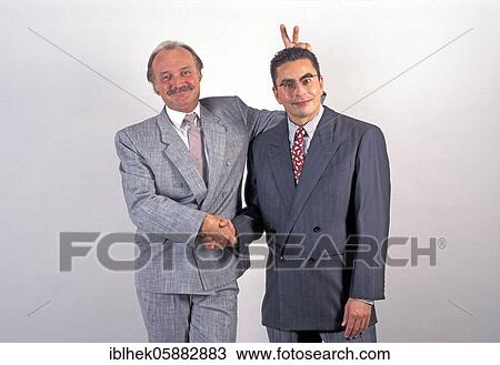 Stock Image - Businessmen are fun, funny, Berlin, Germany, Europe. Fotosearch
