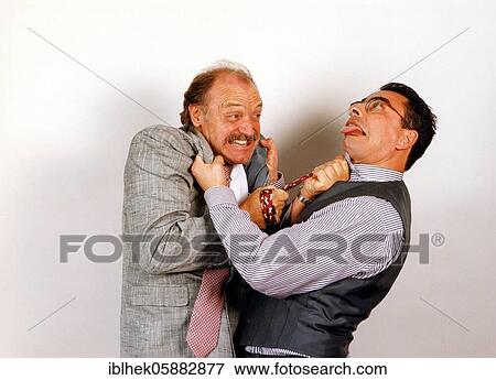 Stock Photo - Businessmen in dispute, funny, fight, Berlin, Germany, Europe. Fotosearch