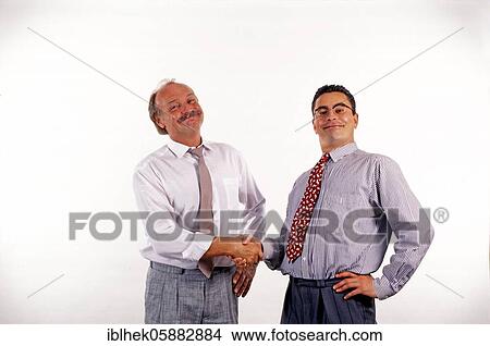 Businessmen shake hands, funny, grin, Berlin, Germany, Europe View Large Photo Image Picture - Businessmen shake hands, funny, grin, Berlin, Germany, Europe. Fotosearch