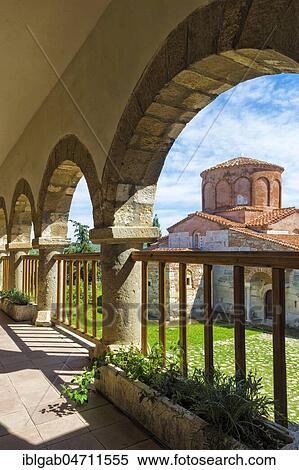 Stock Photography - Byzantine Abbey of Pojan, Saint Mary Orthodox Church and Monastery viewed through arches, Apollonia Archaeological Park, Pojani Village, Illyria, Albania, Europe. Fotosearch
