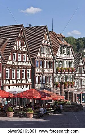 Stock Image - Cafe, restaurant at the market square, market well, half-timbered houses, Calw, Black Forest, Baden-Wuerttemberg, Germany, Europe. Fotosearch