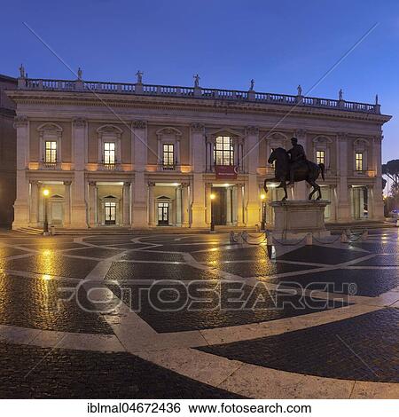 Stock Photograph - Capitol Square with equestrian statue, Piazza del Campidoglio, Capitoline Museums in the back, dusk, Palazzo Nuovo, Rome, Lazio, Italy, Europe. Fotosearch