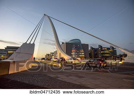 Stock Photography - Cars on Samuel Beckett Bridge, cable-stayed bridge and swing bridge over the river Liffey, blue hour architect Santiago Calatrava, Dublin, Republic of Ireland. Fotosearch