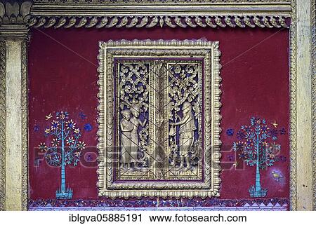 Carved mock window flanked by glass mosaic trees, Temple Wat Souvannakhirii, Luang Prabang, Laos, Asia View Large Photo Image Stock Image - Carved mock window flanked by glass mosaic trees, Temple Wat Souvannakhirii, Luang Prabang, Laos, Asia. Fotosearch