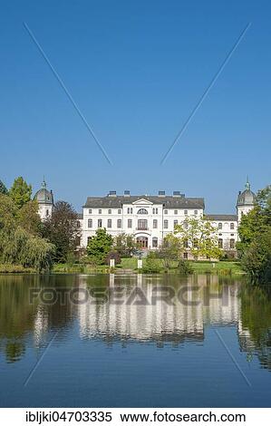 Stock Photography - Castle Gut Salzau with reflection in the water, Fargau-Pratjau, Schleswig-Holstein, Germany, Europe. Fotosearch