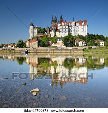 Stock Image - Castle hill with Cathedral and Albrechtsburg Castle is reflected in the river Elbe, Meissen, Saxony, Germany, Europe. Fotosearch