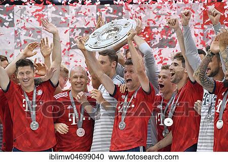 Cheering Thomas Müller FC Bayern Munich after handing over the championship cup, trophy, Allianz Arena, Munich, Bavaria, Germany, Europe View Large Photo Image Stock Image - Cheering Thomas Müller FC Bayern Munich after handing over the championship cup, trophy, Allianz Arena, Munich, Bavaria, Germany, Europe. Fotosearch