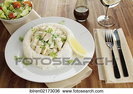 Chicken fricassee with asparagus, peas and mushrooms in a ring of rice, salad, Worcestershire sauce, white wine View Large Photo Image Stock Photograph - Chicken fricassee with asparagus, peas and mushrooms in a ring of rice, salad, Worcestershire sauce, white wine. Fotosearch