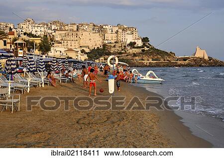 Children playing on the sandy beach of Lido di Fondi, Sperlonga, Lazio, Italy, Europe View Large Photo Image Stock Image - Children playing on the sandy beach of Lido di Fondi, Sperlonga, Lazio, Italy, Europe. Fotosearch