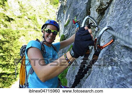 Climbers roped on with carbines, via ferrata Hausbachfall, Reit im Winkl, Chiemgau, Bavaria, Germany, Europe View Large Photo Image Stock Image - Climbers roped on with carbines, via ferrata Hausbachfall, Reit im Winkl, Chiemgau, Bavaria, Germany, Europe. Fotosearch