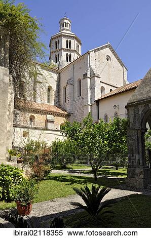 Cloister gardens, bell tower and apse of the Gothic basilica of the Cistercian monastery Fossanova Abbey, near Priverno, Lazio, Italy, Europe View Large Photo Image Stock Photography - Cloister gardens, bell tower and apse of the Gothic basilica of the Cistercian monastery Fossanova Abbey, near Priverno, Lazio, Italy, Europe. Fotosearch