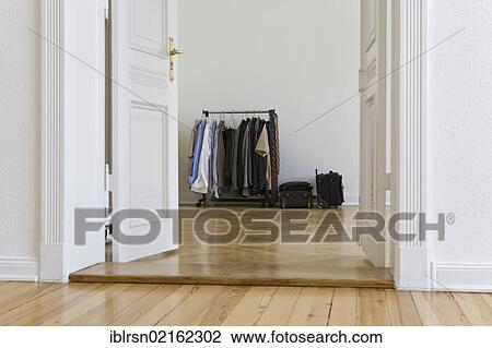 Stock Image - Clothing rack in an empty apartment shortly before the arrival of new tenants, Berlin, Germany, Europe. Fotosearch