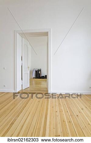Clothing rack in an empty apartment shortly before the arrival of new tenants, Berlin, Germany, Europe View Large Photo Image Stock Image - Clothing rack in an empty apartment shortly before the arrival of new tenants, Berlin, Germany, Europe. Fotosearch