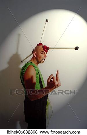 Stock Photo - Clown, bald head, plump, punk, middle finger, Berlin, Germany, Europe. Fotosearch