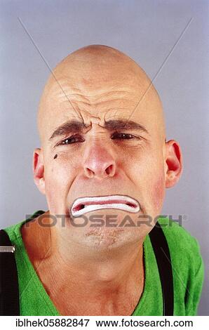 Stock Photo - Clown, bald head, sad, Berlin, Germany, Europe. Fotosearch