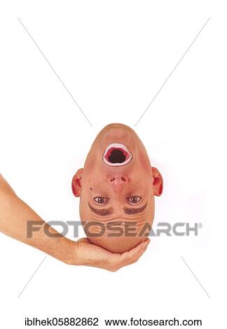 Stock Image - Clown, holding his head in his hand, Berlin, Germany, Europe. Fotosearch