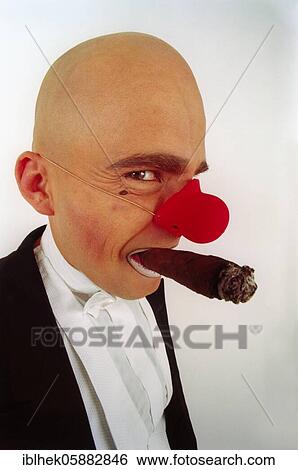 Stock Photograph - Clown, red nose, cigar, bald head, laughs, Berlin, Germany, Europe. Fotosearch