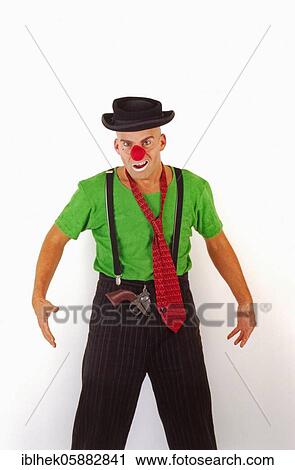 Stock Image - Clown with pistol, red nose, Berlin, Germany, Europe. Fotosearch