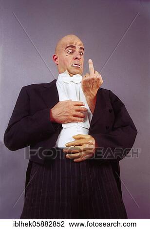 Stock Image - Clown with three hands, middle finger, funny, Berlin, Germany, Europe. Fotosearch