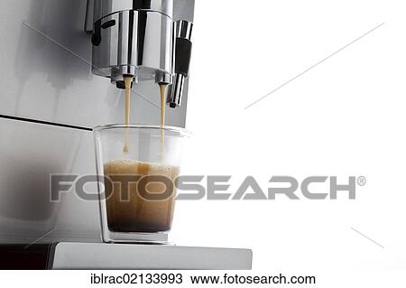 Coffee flowing from espresso machine into glass cup View Large Photo Image Stock Image - Coffee flowing from espresso machine into glass cup. Fotosearch